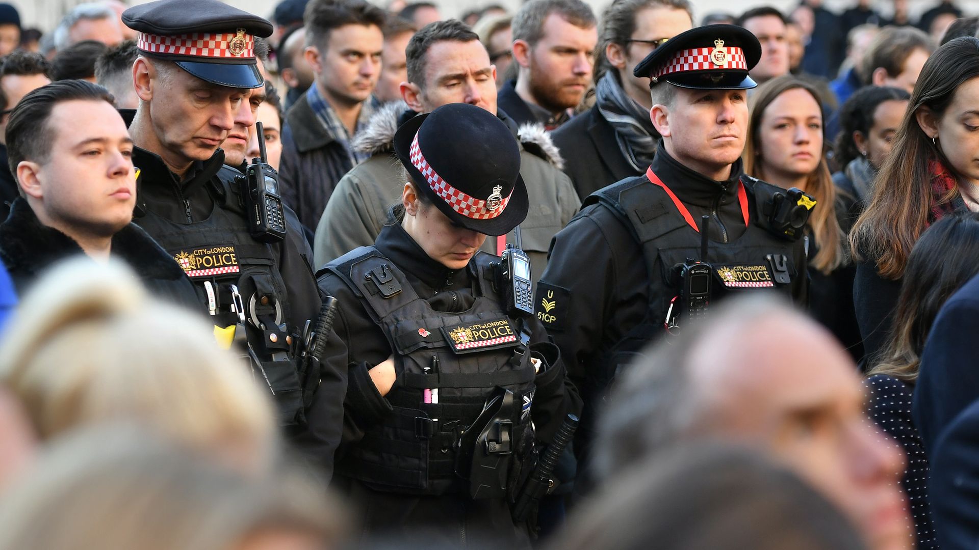 Police officers at a vigil in Guildhall Yard, London, to honour the victims off the London Bridge terror attack - Credit: PA