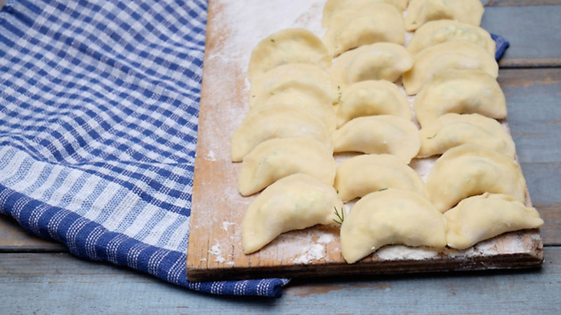 Vareniki dumplings , pierogi before boiling on the blue napkin. Rustic style - Credit: Getty Images/iStockphoto