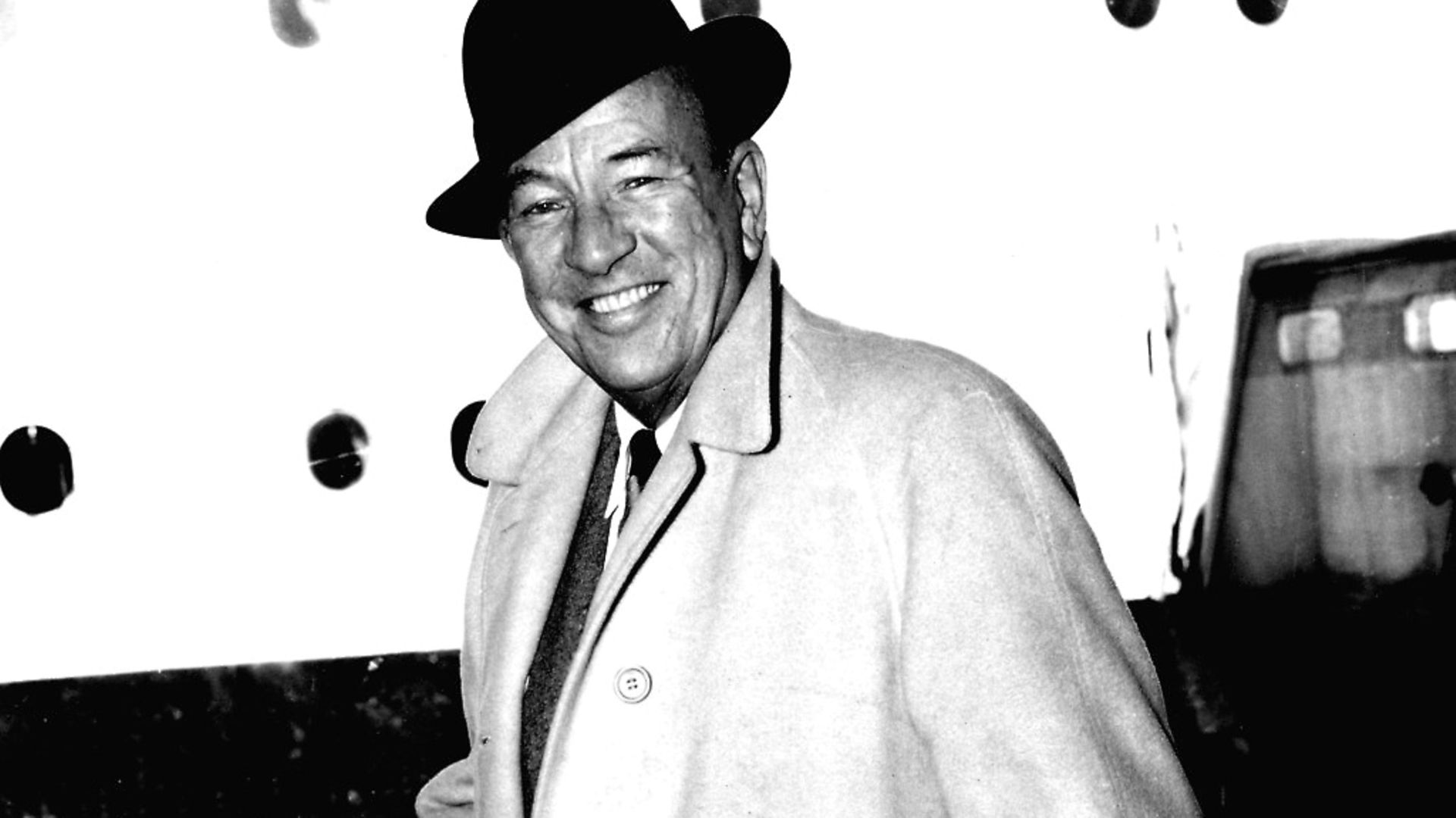 Actor and Playwright Noel Coward on arrival at Southampton from New York, aboard the liner Queen Mary. - Credit: PA Archive/PA Images