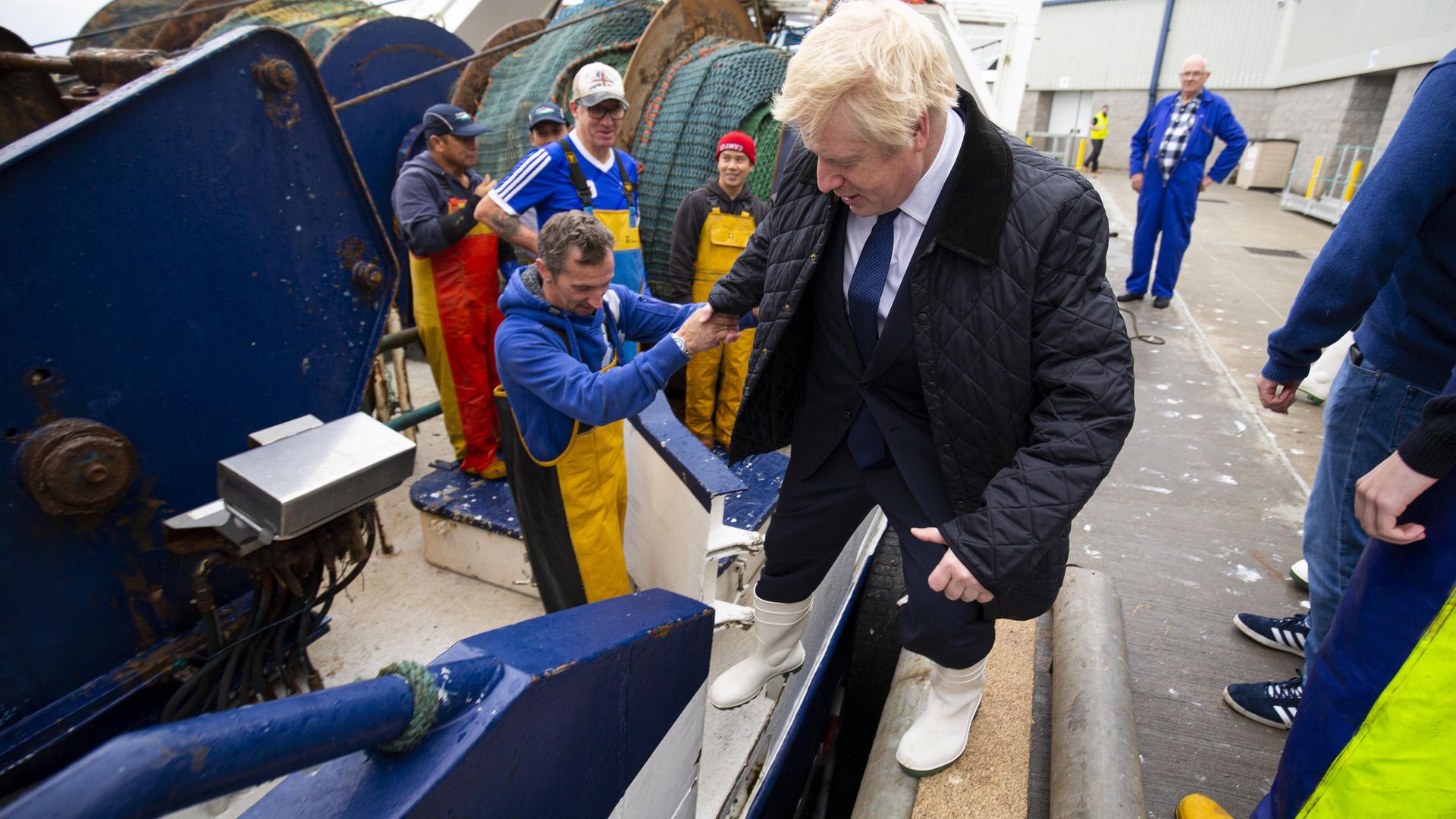 Prime Minister Boris Johnson on the Opportunis IV fishing trawler, during a visit to Peterhead fish market near Aberdeen - Credit: PA