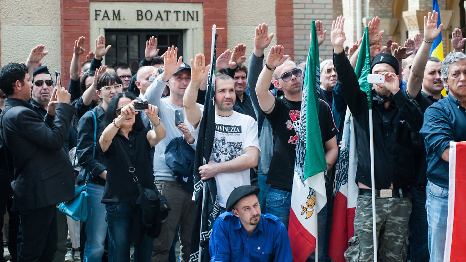 Members of the Italian far-right are seen giving the Roman salute during the celebration of the life and death of Benito Mussolini in Predappio on April 27, 2014.The commemoration of Mussolini is an annual event, when far-right members celebrate the life and death of the dictator as well as the march on Rome. PHOTO: Piero Cruciatti/PA - Credit: PA Images