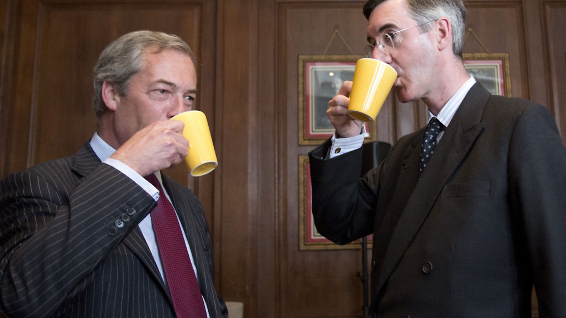 Nigel Farage and Conservative MP Jacob Rees-Mogg (right) meet at a Bruges Group event in central London. Photograph: Isabel Infantes/PA. - Credit: EMPICS Entertainment
