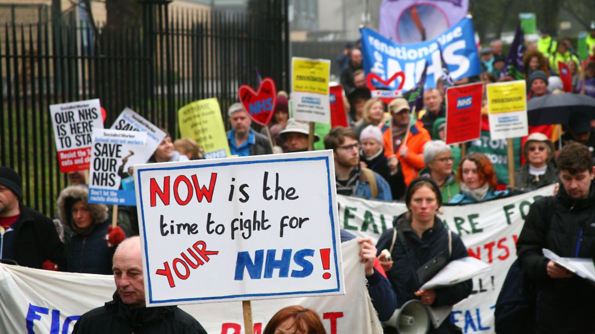 Protesters hold signs during a demonstration in Newcastle to demand an end to the "crisis" in the NHS Photo: PA - Credit: PA Images