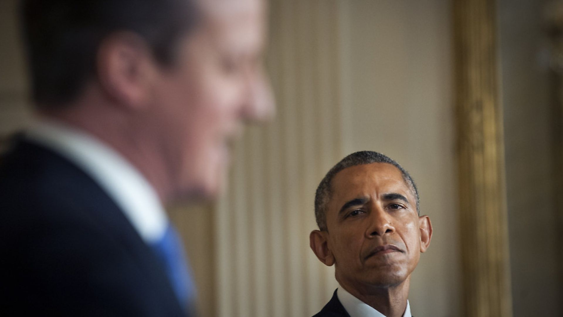 U.S. President Barack Obama, right, listens during a joint news conference with David Cameron, U.K. prime minister, in the East Room of the White House in Washington, D.C., U.S., on Friday, Jan. 16, 2015. Obama and Cameron today announced efforts to bolster hacking threats, including the creation of a joint cybersecurity unit between intelligence and law enforcement agencies. Photographer: Pete Marovich/Bloomberg via Getty Images - Credit: Bloomberg via Getty Images