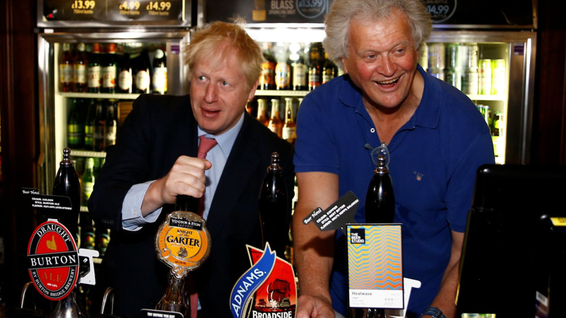 Boris Johnson during a visit to Wetherspoons Metropolitan Bar in London with Tim Martin, chair of JD Wetherspoon - Credit: Henry Nicholls/PA Wire/PA Images