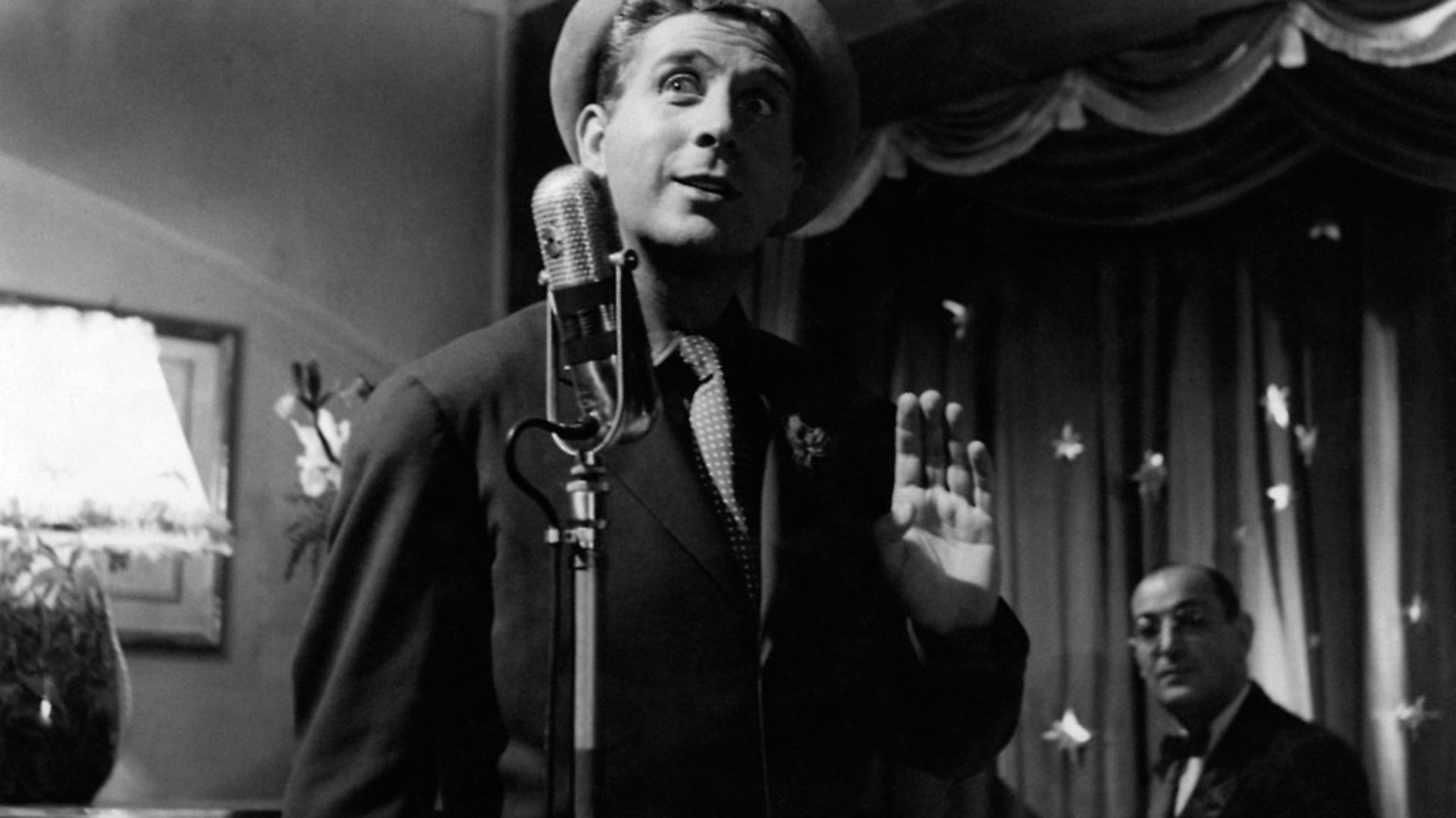 French actor, singer and songwriter Charles Trenet singing in Giovinezza. Italy, 1952 (Photo by Mondadori Portfolio by Getty Images) - Credit: Mondadori via Getty Images