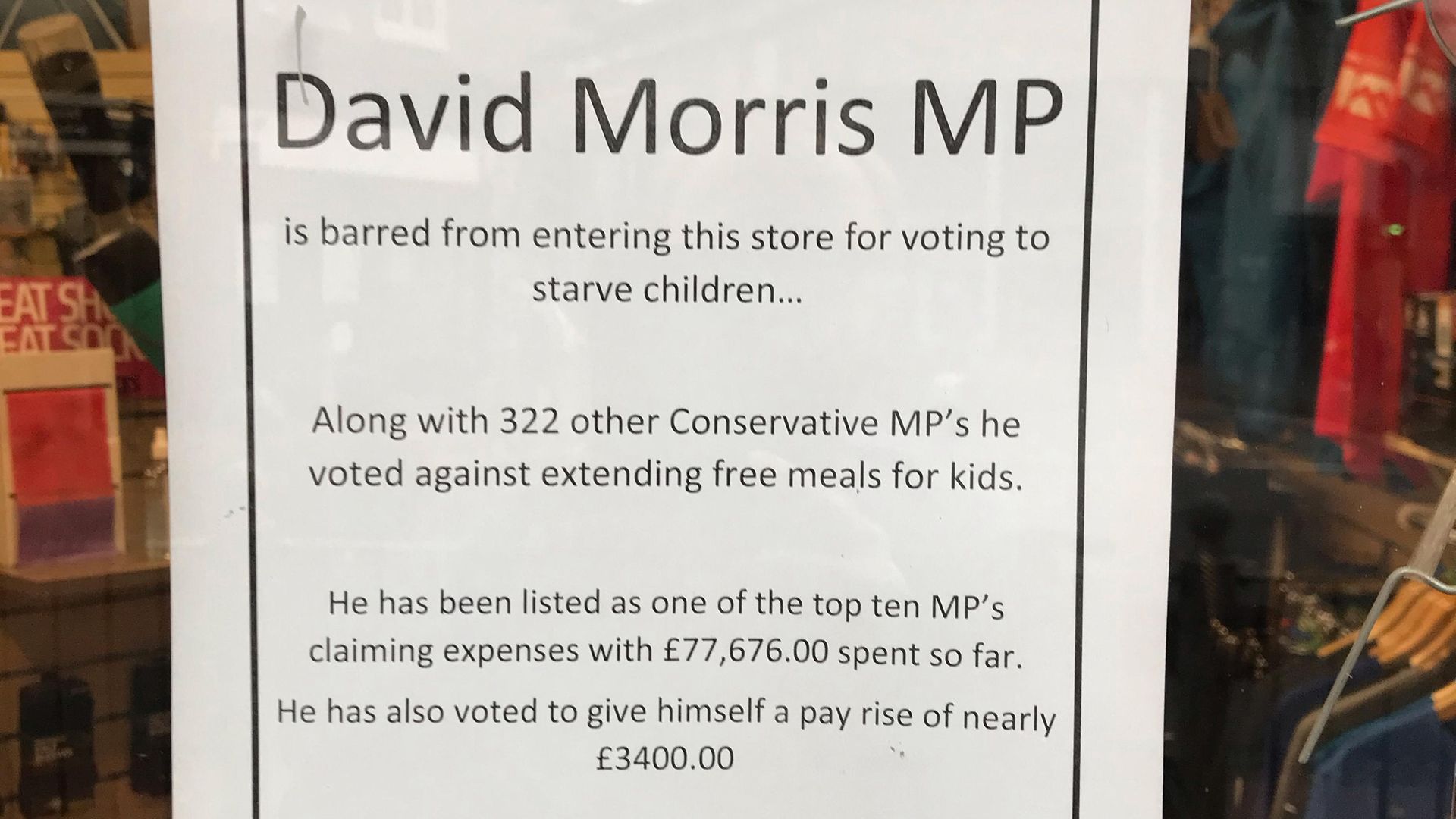 Photo of a sign on the door of the Runner's Centre in Lancaster, where the owner Ian Bailey has barred local MP David Morris after he voted not to extend free school meals over half term - Credit: PA