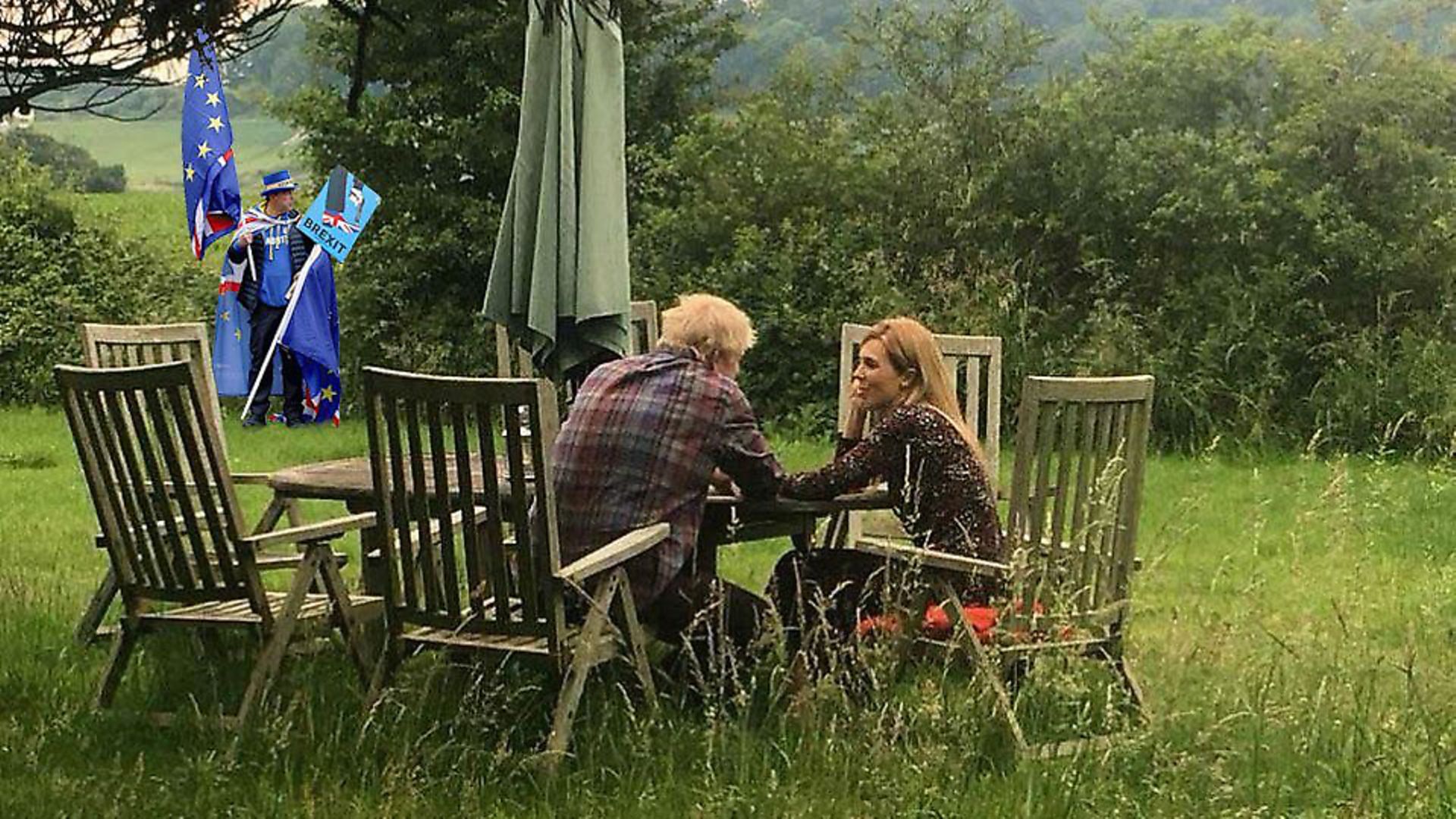 Steve Bray enters the frame as Boris Johnson and Carrie Symonds pose for a 'staged' photograph. (Louis Henwood/Twitter) - Credit: Archant