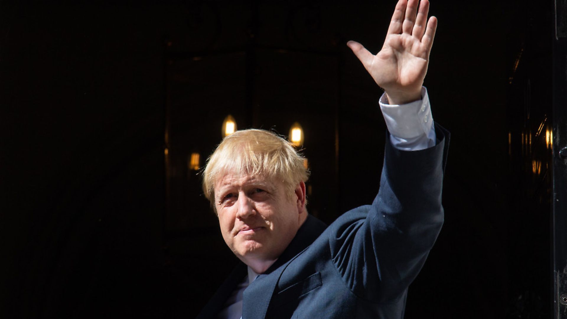New prime minister Boris Johnson waves on the steps of 10 Downing Street. Photograph: Dominic Lipinski/PA Wire. - Credit: PA