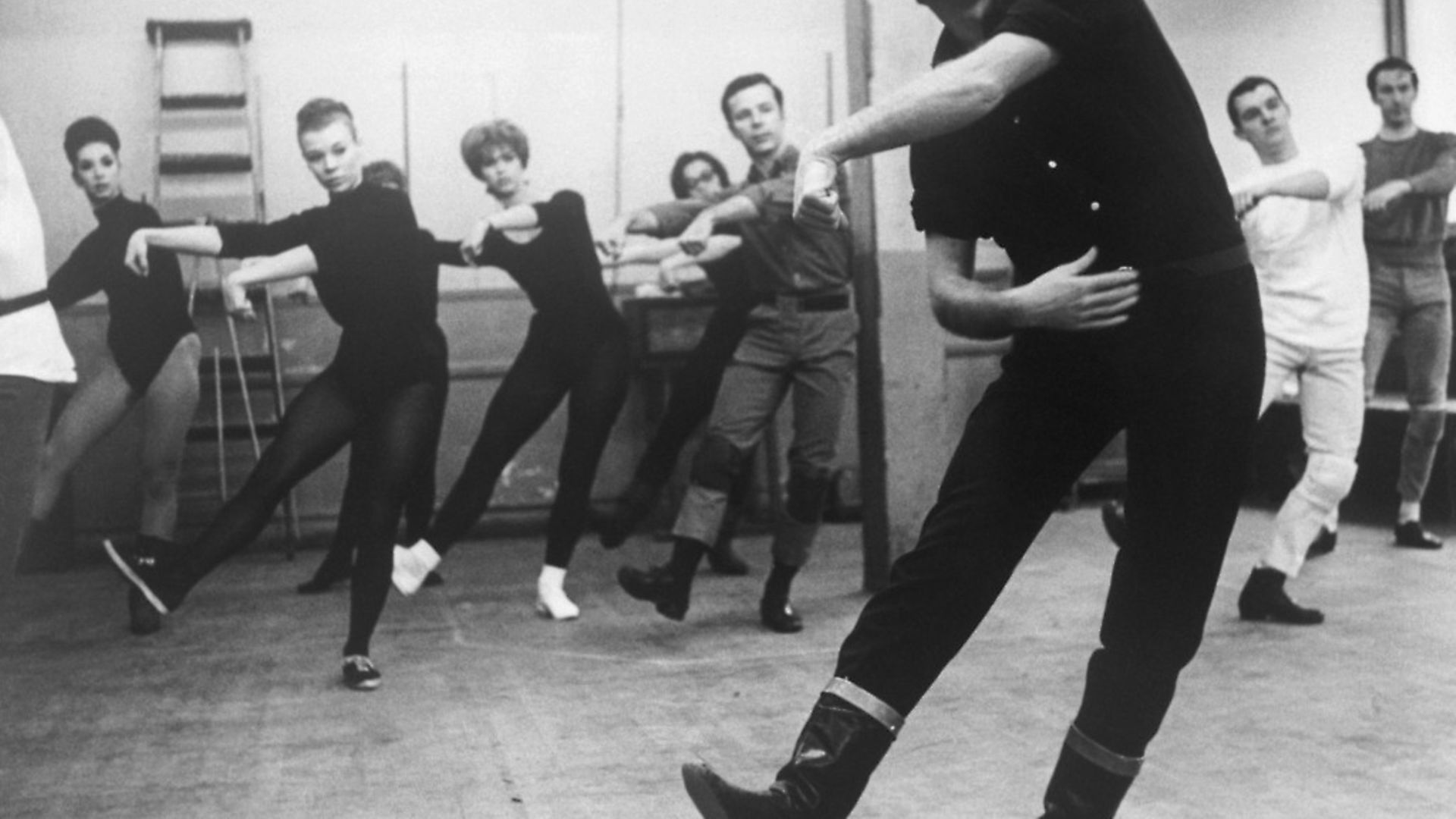 Choreographer Bob Fosse leads dancers for the musical "Pleasures and Palaces" he directed in 1965. - Credit: Bettmann Archive