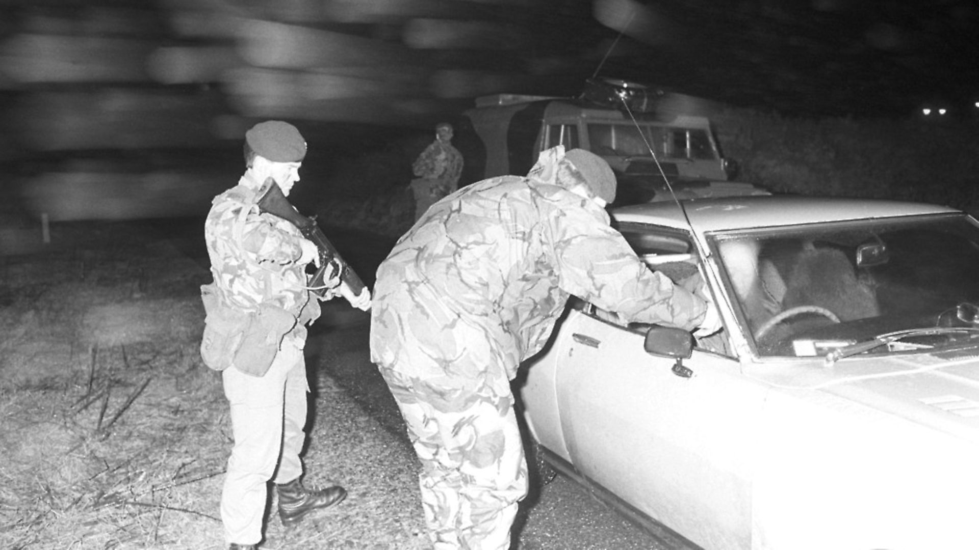 Members of the Ulster Defence Regiment search a car at a checkpoint while on patrol in County Down, Northern Ireland on February 05, 1984. (Photo by Terry Disney/Express/Getty Images) - Credit: Getty Images