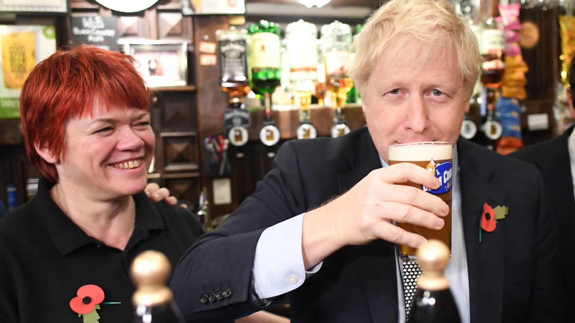 Boris Johnson, drinks from a pint at the Lych Gate Tavern in Wolverhampton. Photograph: Stefan Rousseau/PA Wire. - Credit: PA