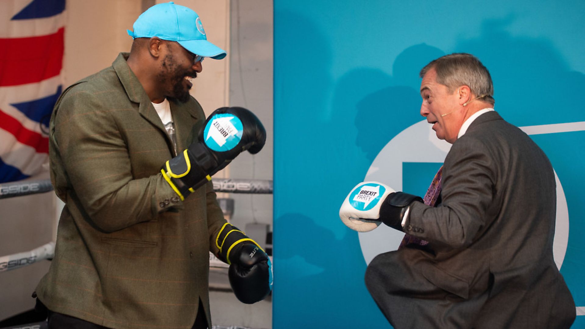 Heavyweight boxer Dereck Chisora with Brexit Party leader Nigel Farage during a party rally at the Gator ABC Boxing Club, in Hainault, Ilford, Essex. Photograph: Joe Giddens/PA Wire. - Credit: PA