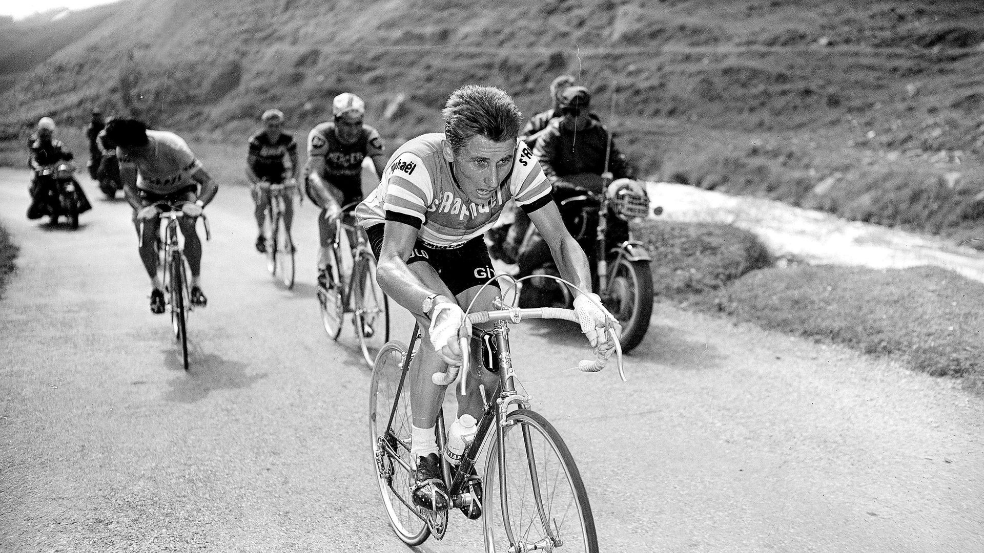 Jacques Anquetil, centre, and rival Raymond Poulidor during one of their Tour de France battles - Credit: Roger Viollet via Getty Images