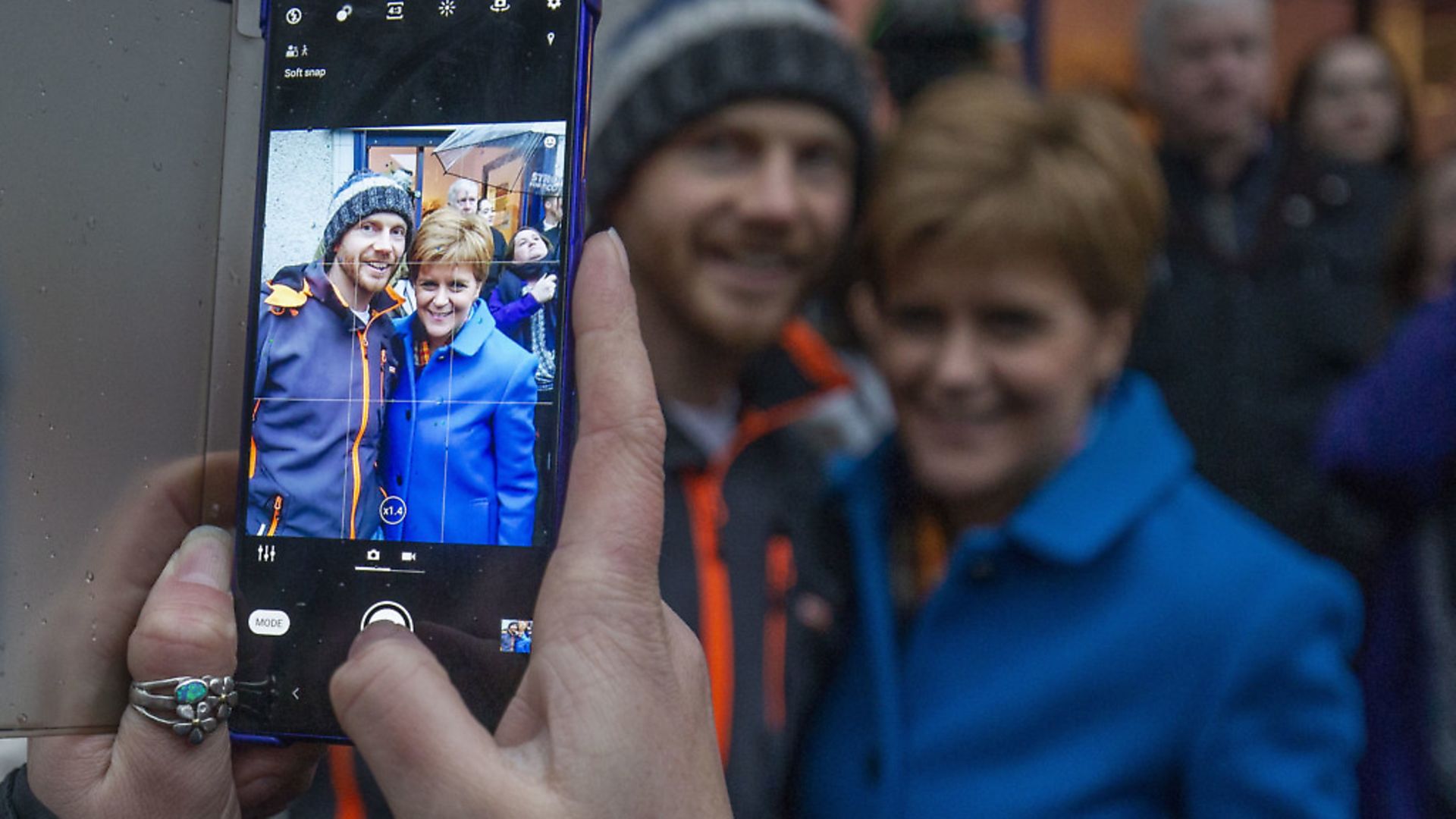 SNP leader Nicola Sturgeon takes pictures with supporters during a visit to Craig Boyd Hairdressing in Leven, Fife. Photograph: Jane Barlow/PA Wire. - Credit: PA