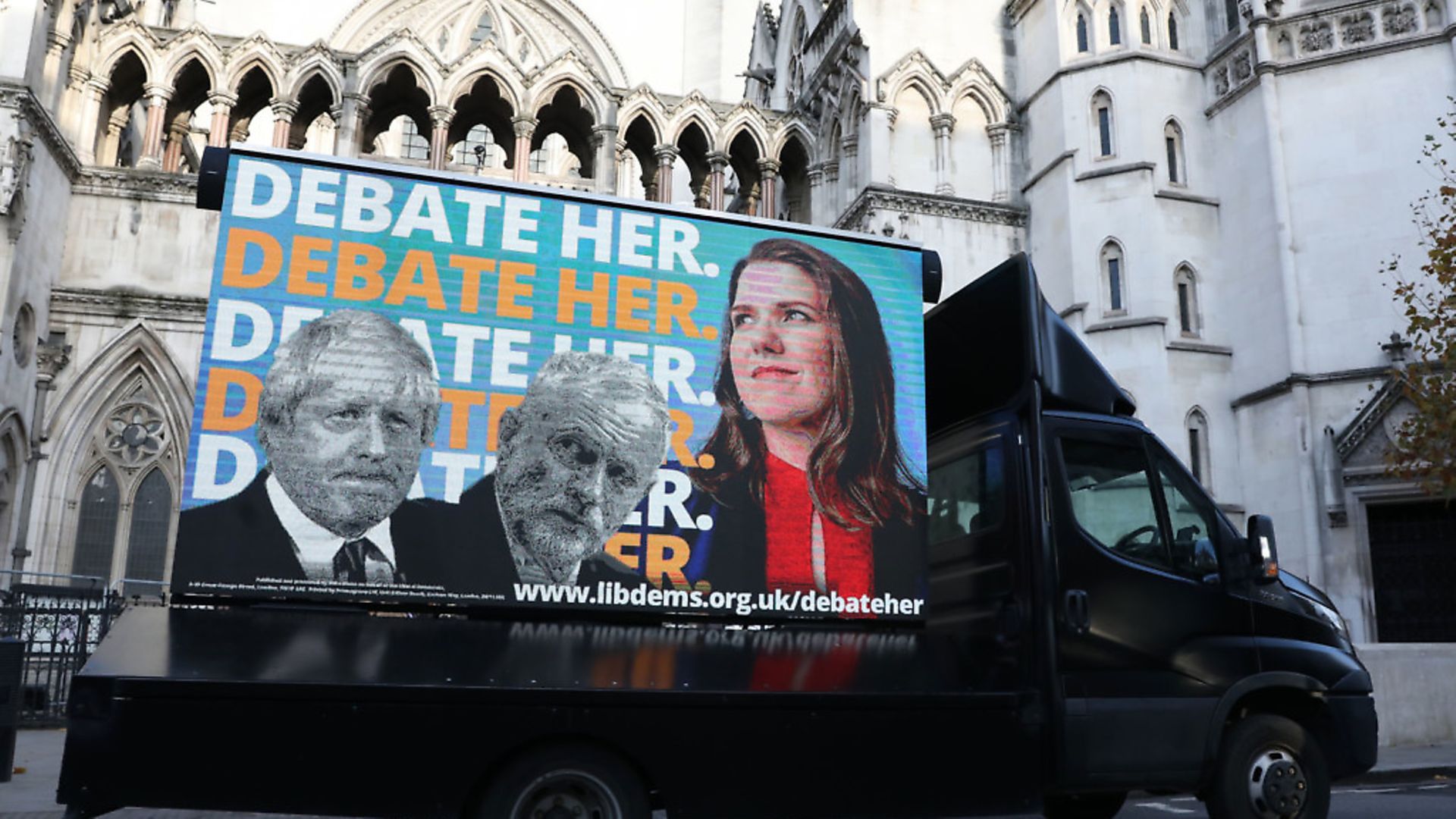 An advertising van showing Prime Minister Boris Johnson, Labour Party leader Jeremy Corbyn and Liberal Democrat leader Jo Swinson, outside the Royal Courts of Justice, London, where the Liberal Democrat party are challenging ITV over the broadcaster's exclusion of their leader Jo Swinson from a televised debate. Photo: Isabel Infantes/PA Wire - Credit: PA