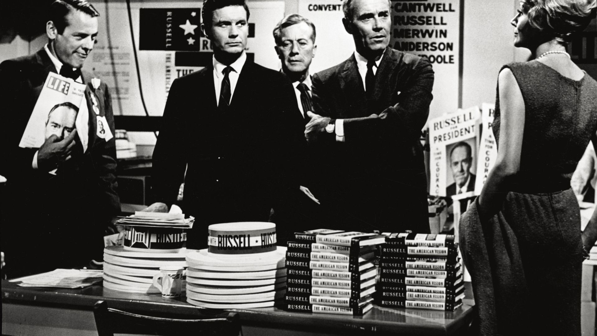 Cliff Robertson (the second from the left) and Henry Fonda (with his arms folded) play the role of two politicians running for the Presidency of the United States in the film 'The Best Man' - Credit: Mondadori via Getty Images