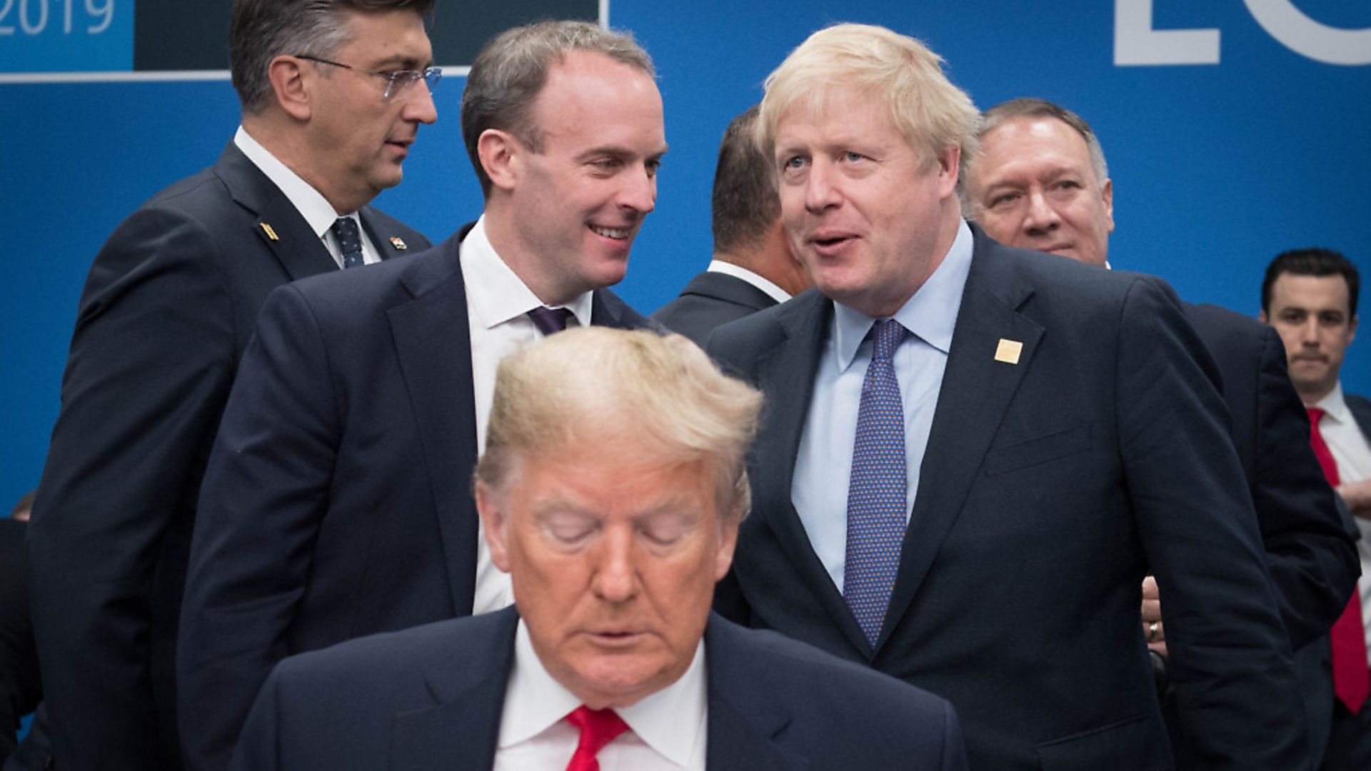US President Donald Trump (front) with Dominic Raab (centre left) and Boris Johnson (centre right) at a Nato summit. Photograph: PA/Stefan Rousseau. - Credit: PA Wire/PA Images