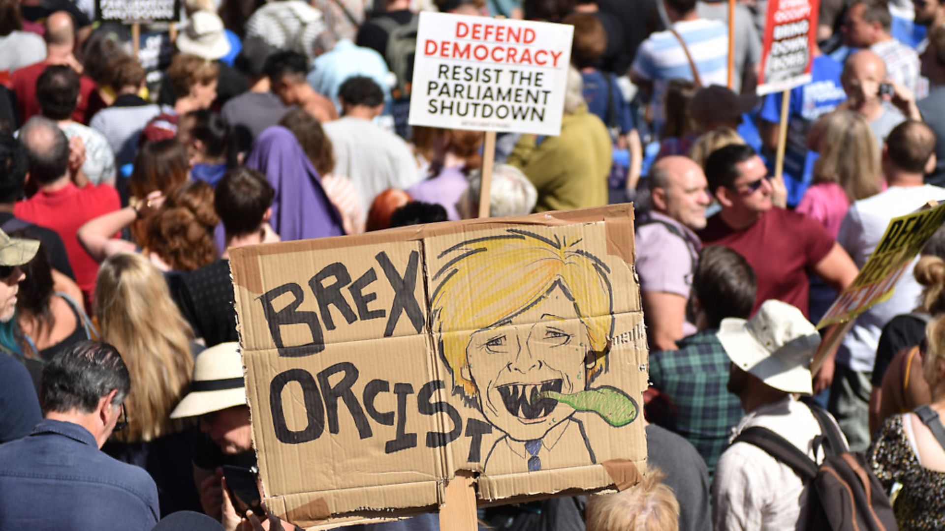 A protester holds a placard of Boris Johnson with the words "Brex Orcist" outside Downing Street for the "Stop The Coup" protests. (Photo by John Keeble/Getty Images) - Credit: Getty Images