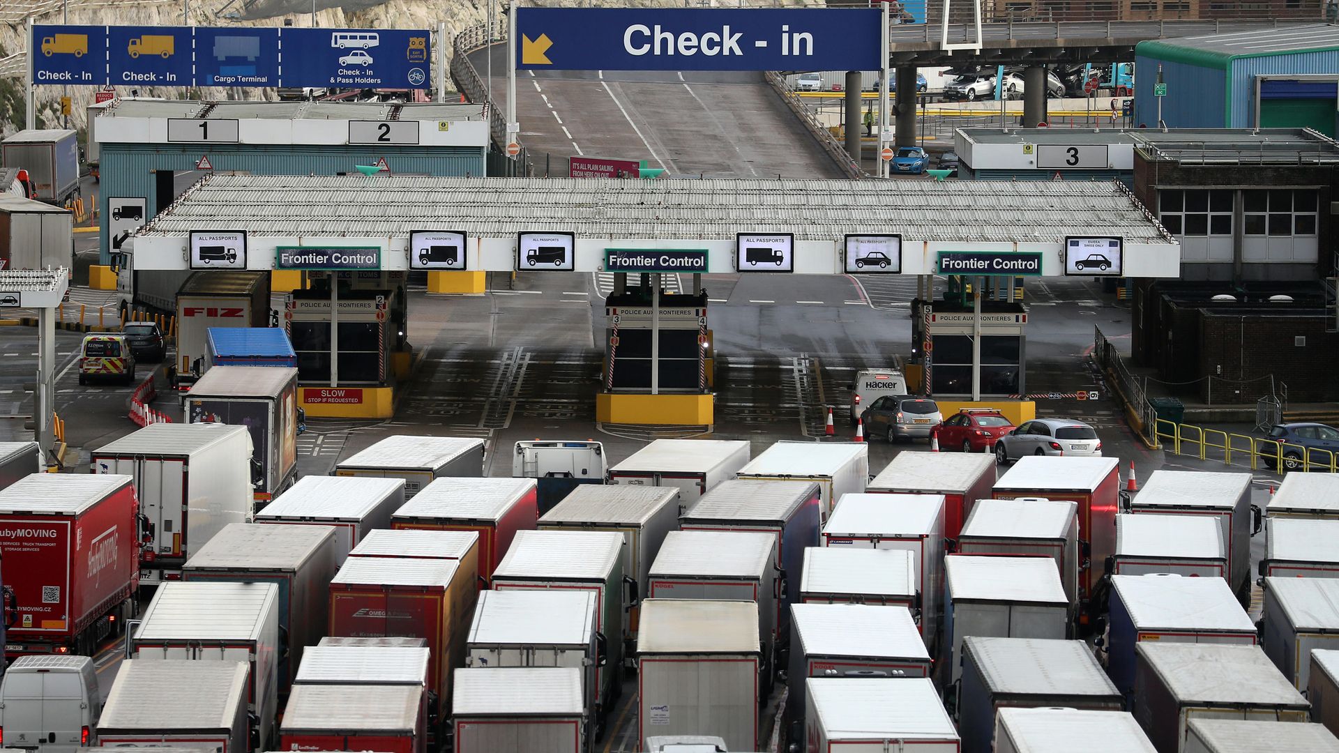 Lorries queue to enter The Port of Dover in Kent as the clock ticks down on the chance for the UK to strike a deal before the end of the Brexit transition period on December 31. - Credit: PA