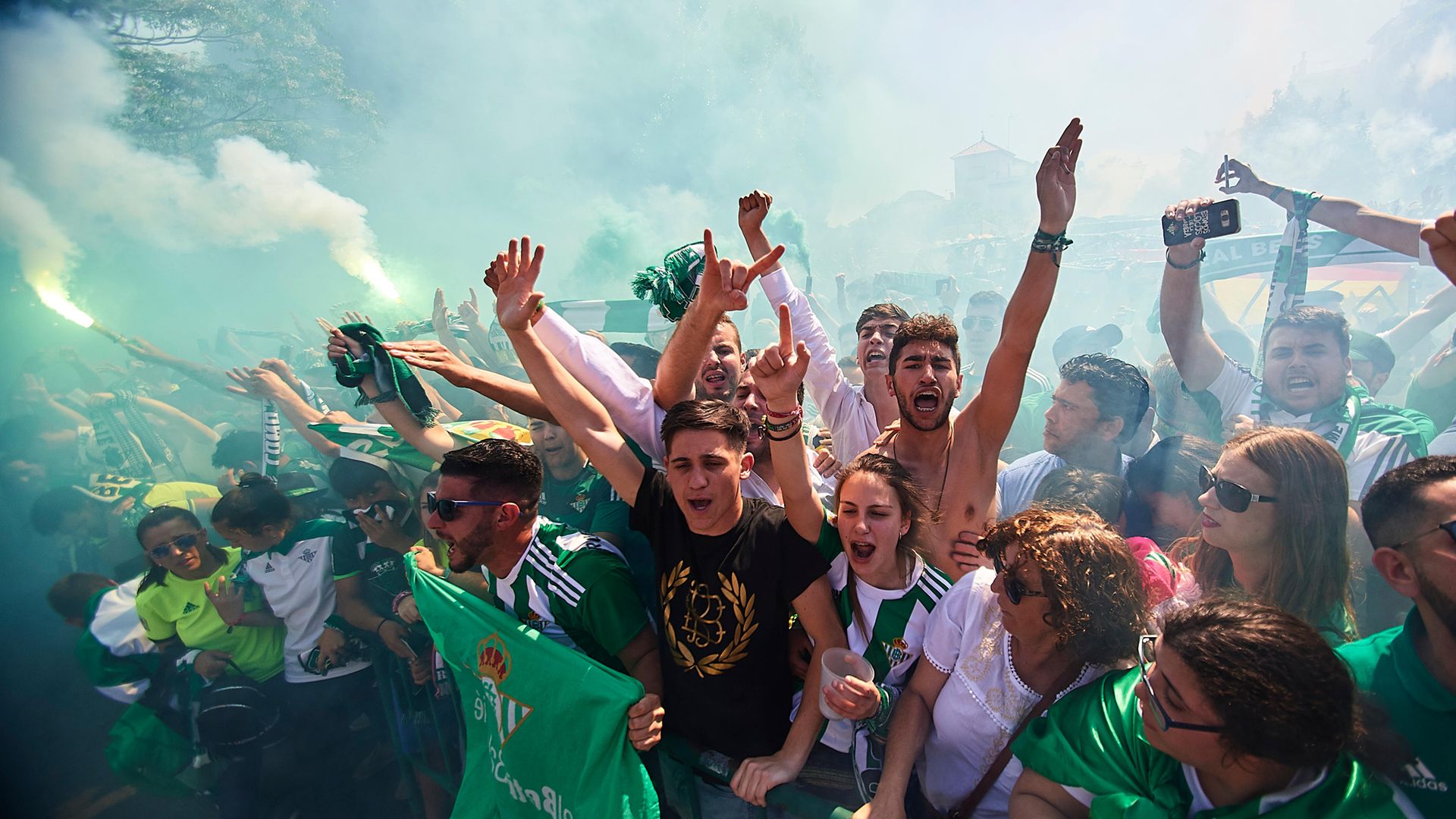 Fans of Real Betis support their team as it arrives at the stadium for a game against local rivals Sevilla in 2018 - Credit: Getty Images