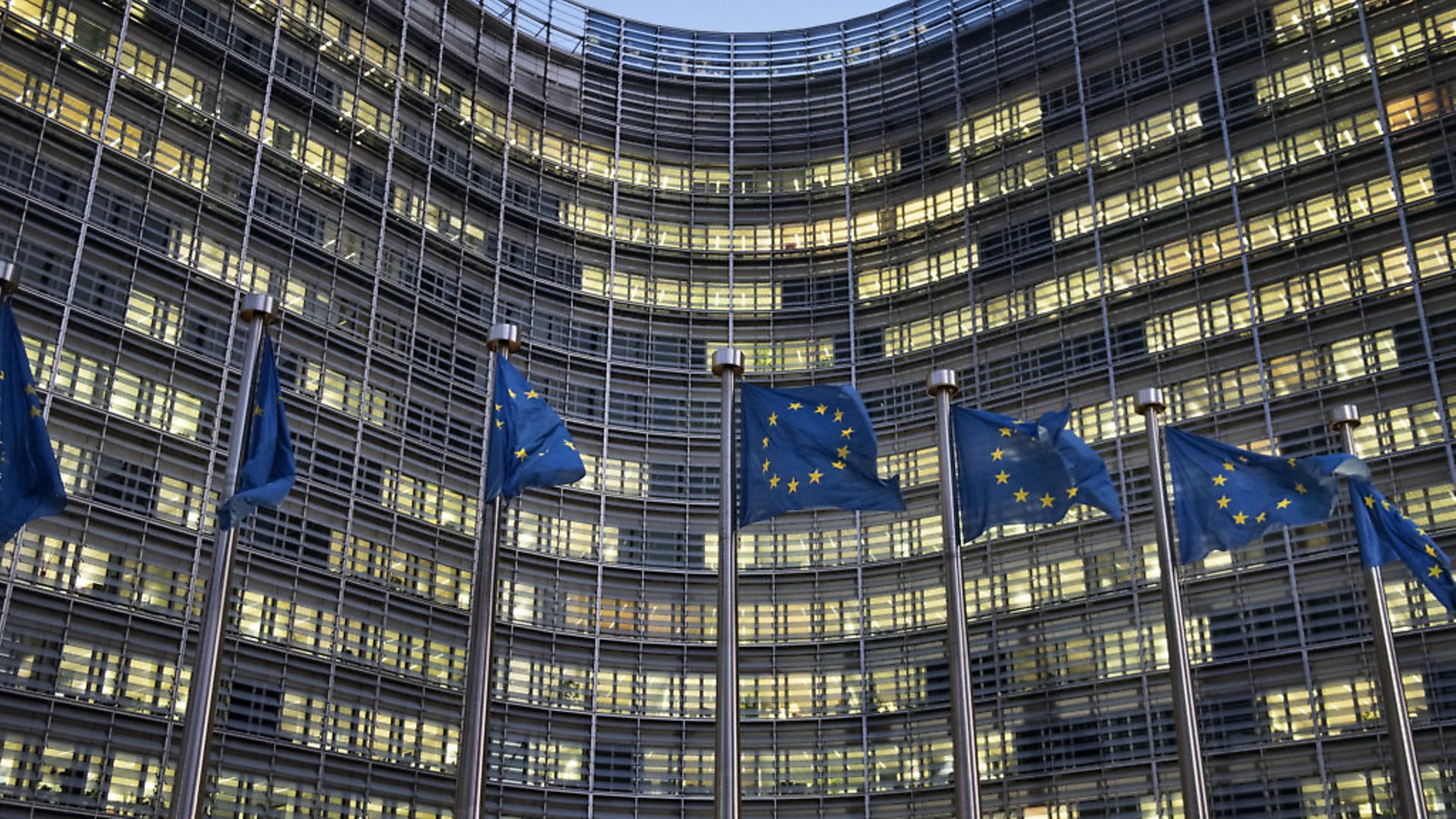 European flags wave in front of the Berlaymont building - European Commission (EC) headquarter - in Brussels, Belgium (Photo by Michele Spatari/NurPhoto via Getty Images) - Credit: NurPhoto via Getty Images