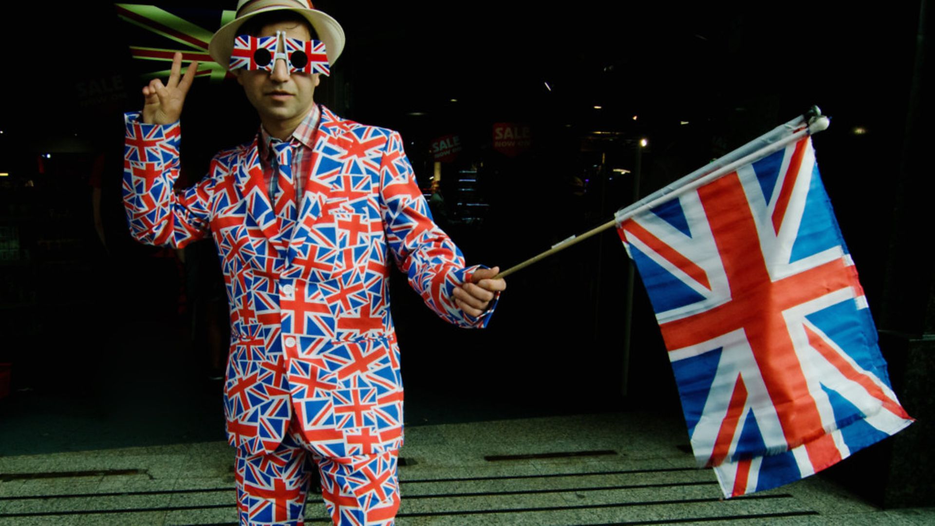 A man wearing a costume in the colors of the United Kingdom flag as Britain voted for Brexit - Credit: PA Images