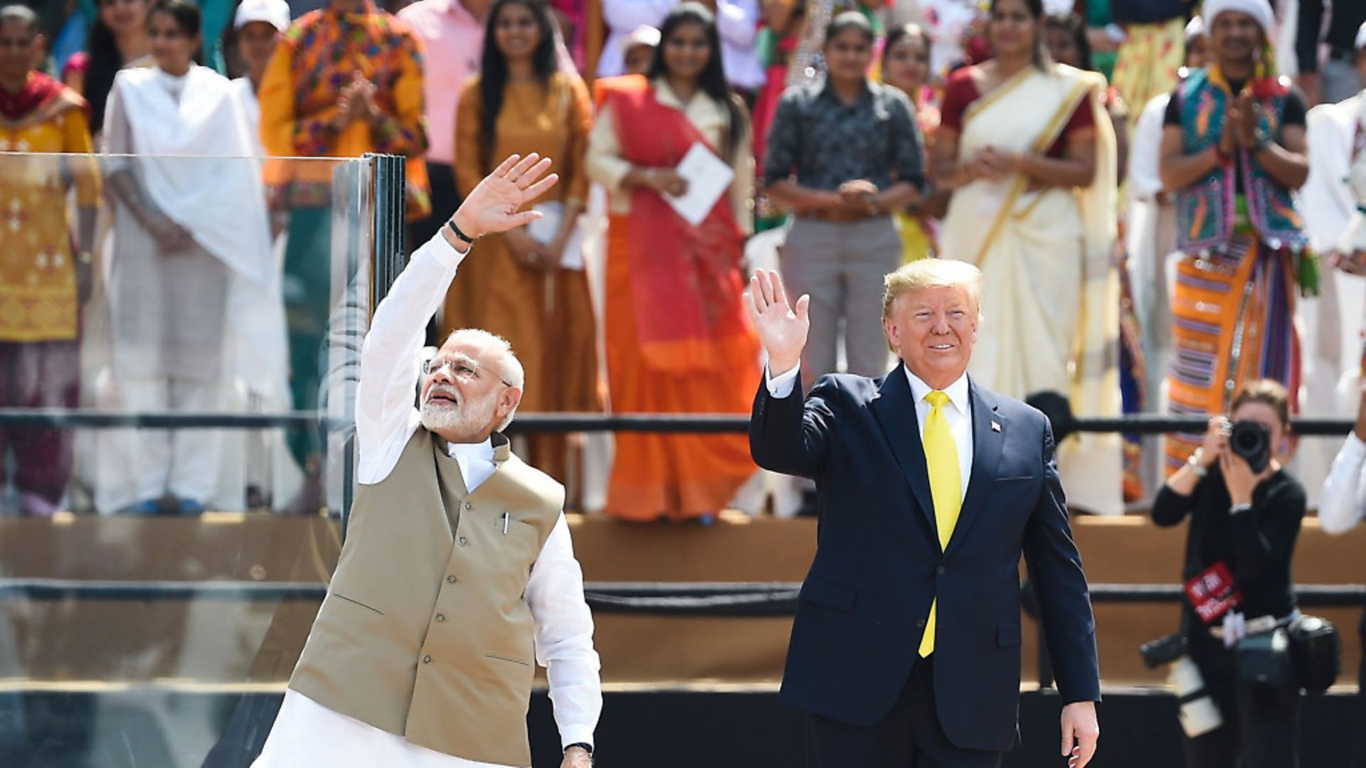 US President Donald Trump (R) and India's Prime Minister Narendra Modi wave at the crowd during 'Namaste Trump' rally at Sardar Patel Stadium in Motera. Photo: MONEY SHARMA/AFP via Getty Images - Credit: AFP via Getty Images