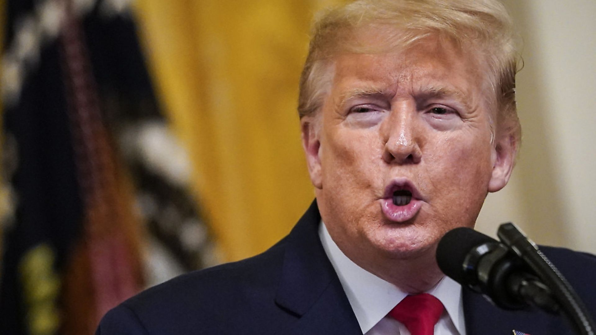 U.S. President Donald Trump speaks in the East Room of the White House. Photo: Drew Angerer/Getty Images. - Credit: Getty Images