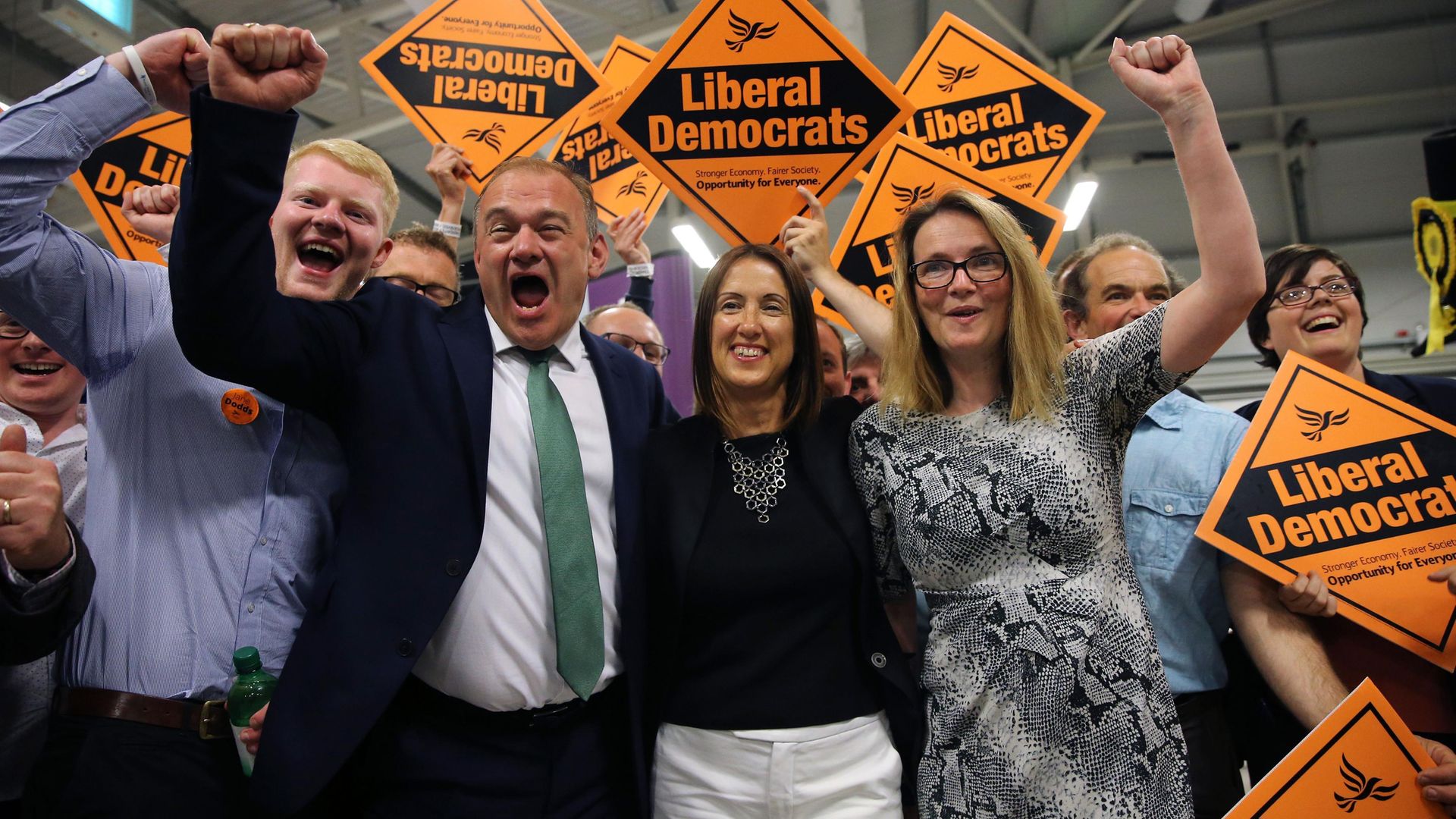 Ed Davey, now party leader, celebrates with Jane Dodds (C) and her team, after she won the Brecon and Radnorshire byelection in August 2019 - Credit: AFP via Getty Images