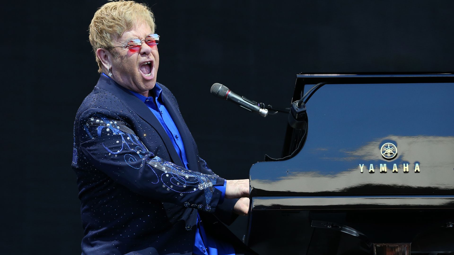 Elton John performing on stage - Credit: PA