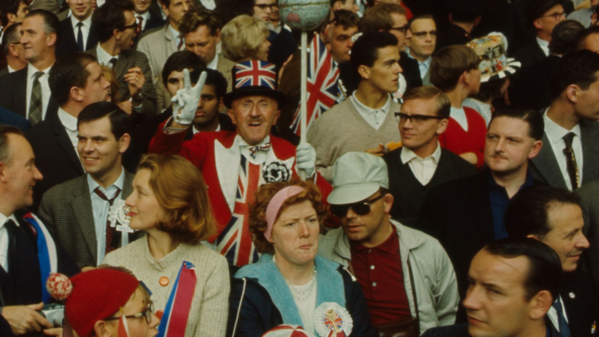 UNITED CHAMPIONS: Union flags aplenty amid England fans at Wembley during the 1966 World Cup - Credit: Getty Images