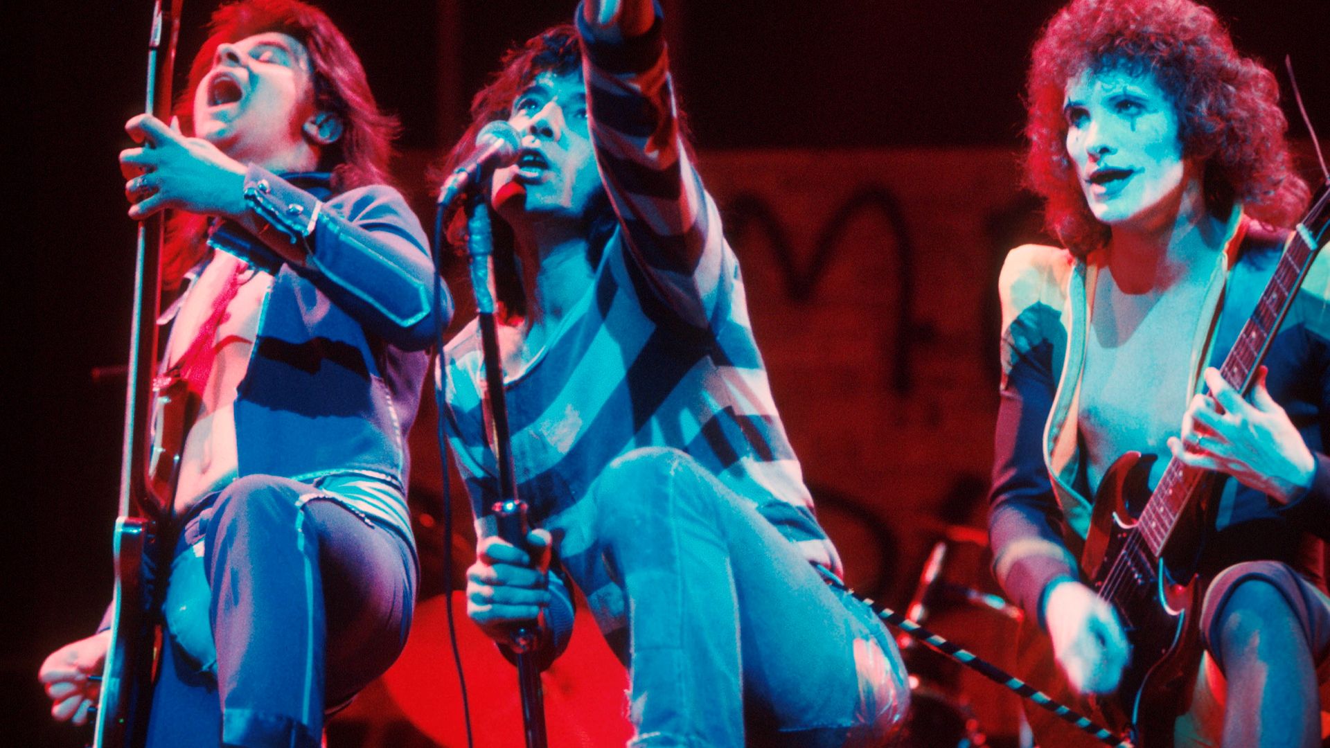 The Sensational Alex Harvey Band perform on stage in 1975. From left to right: Chris Glen, Alex Harvey, Zal Cleminson - Credit: Getty Images