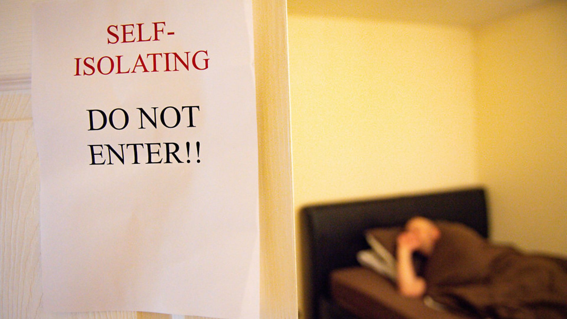 A model poses to illustrate self-isolating measures during the coronavirus outbreak. Photograph: Jacob King/PA Wire. - Credit: PA