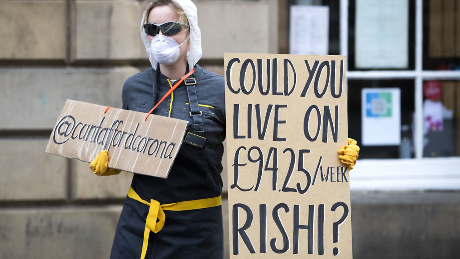 A demonstrator protests about the level of financial support for freelance and self employed workers during the coronavirus outbreak. Photograph: Jane Barlow/PA Wire. - Credit: PA