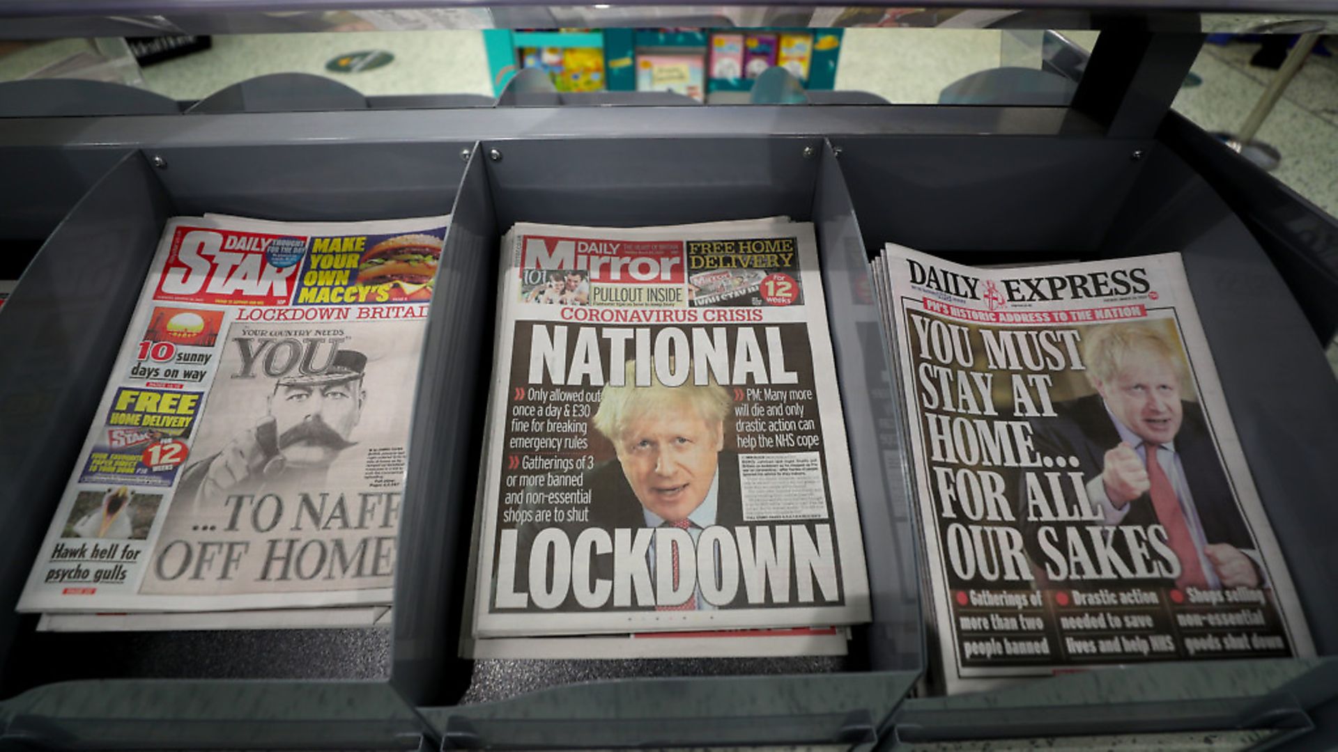 Newspapers displayed at a local shop the day after Boris Johnson put the UK in lockdown to help curb the spread of the coronavirus. Photograph: David Davies/PA. - Credit: PA