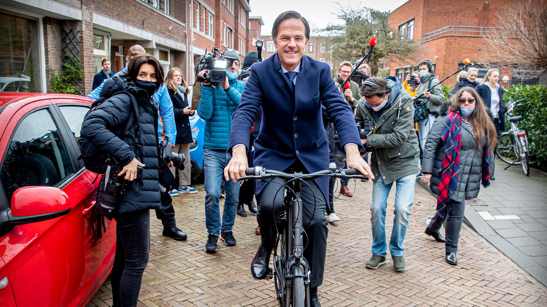 Mark Rutte cycles to the polling station in the recent Netherlands election, which was won by his party - Credit: Getty Images