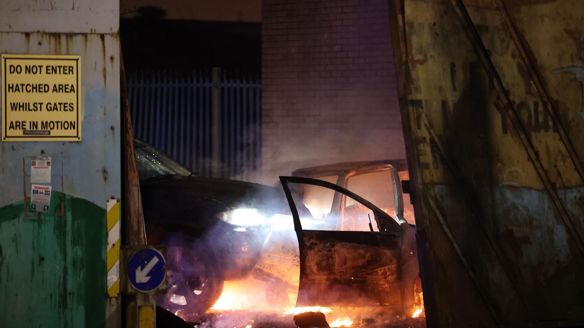 Cars that people on the loyalist side tried to drive through the Peace Gates in Lanark Way, Belfast - Credit: PA