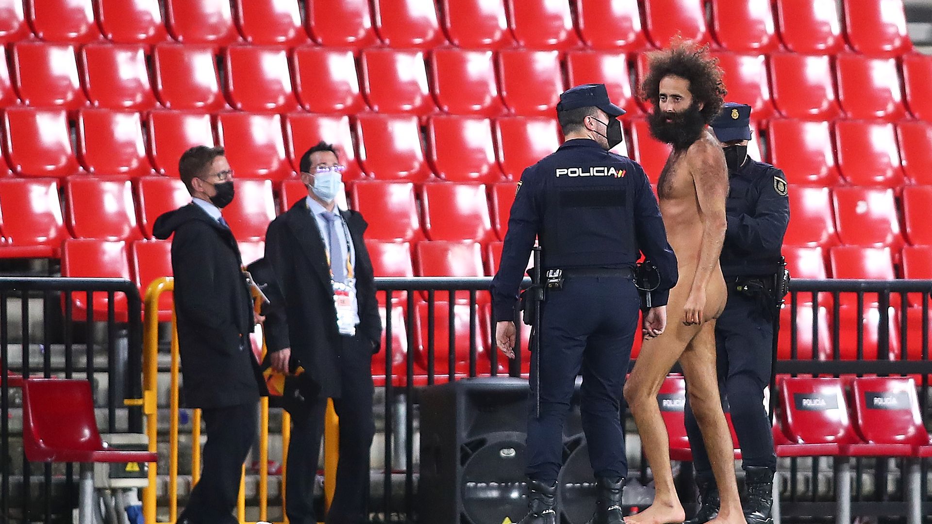 Streaker Olmo Garcia is removed from the pitch during the UEFA Europa League quarter-final first leg match between Granada CF and Manchester United at Los Carmenes on April 08, 2021 - Credit: Photo by Fran Santiago/Getty Images