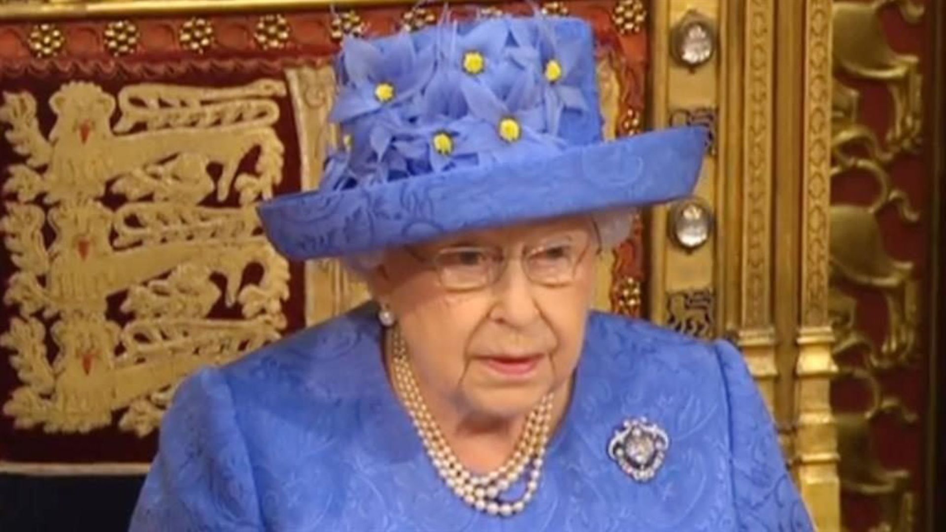 The Queen in blue and yellow at the state opening of parliament in 2017 - Credit: Parliament Live