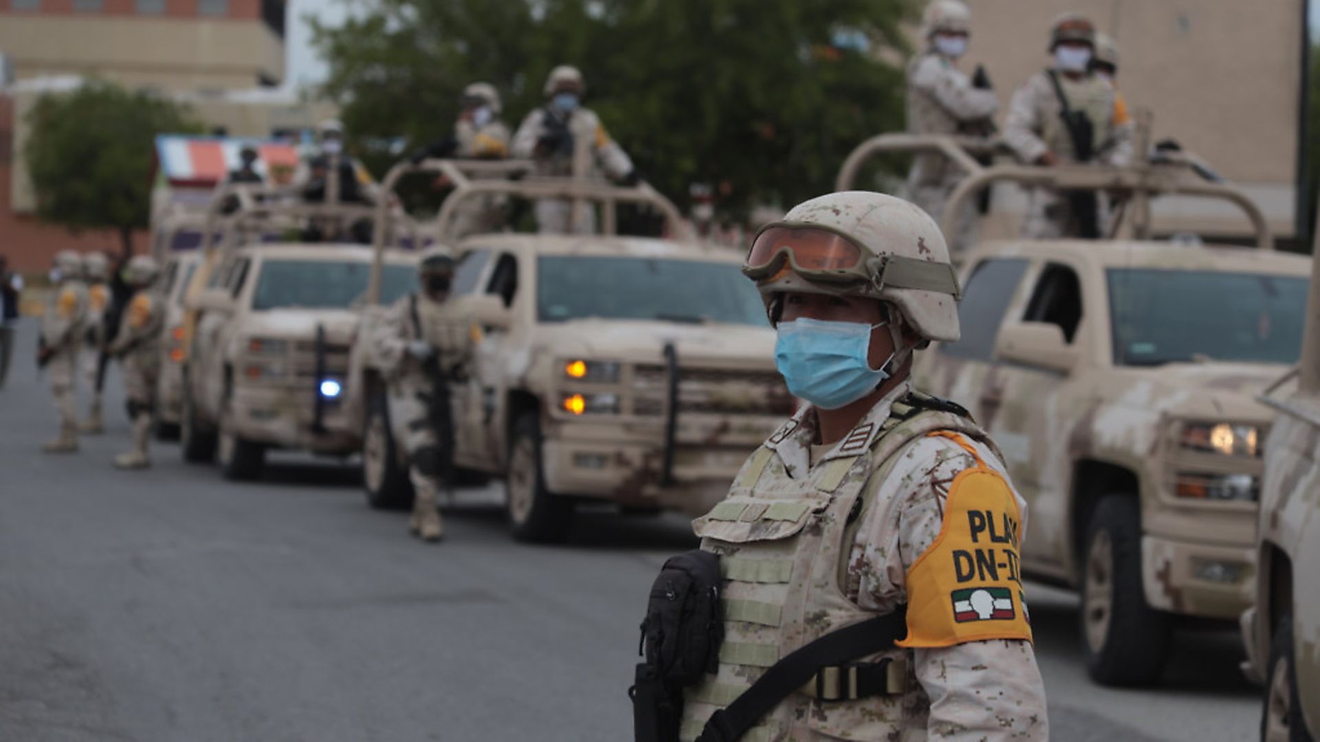 Mexican army soldiers use facial masks on duty to help prevent COVID-19 infections. Photo: David Peinado/Pacific Press/LightRocket via Getty Images - Credit: Pacific Press/LightRocket via Ge