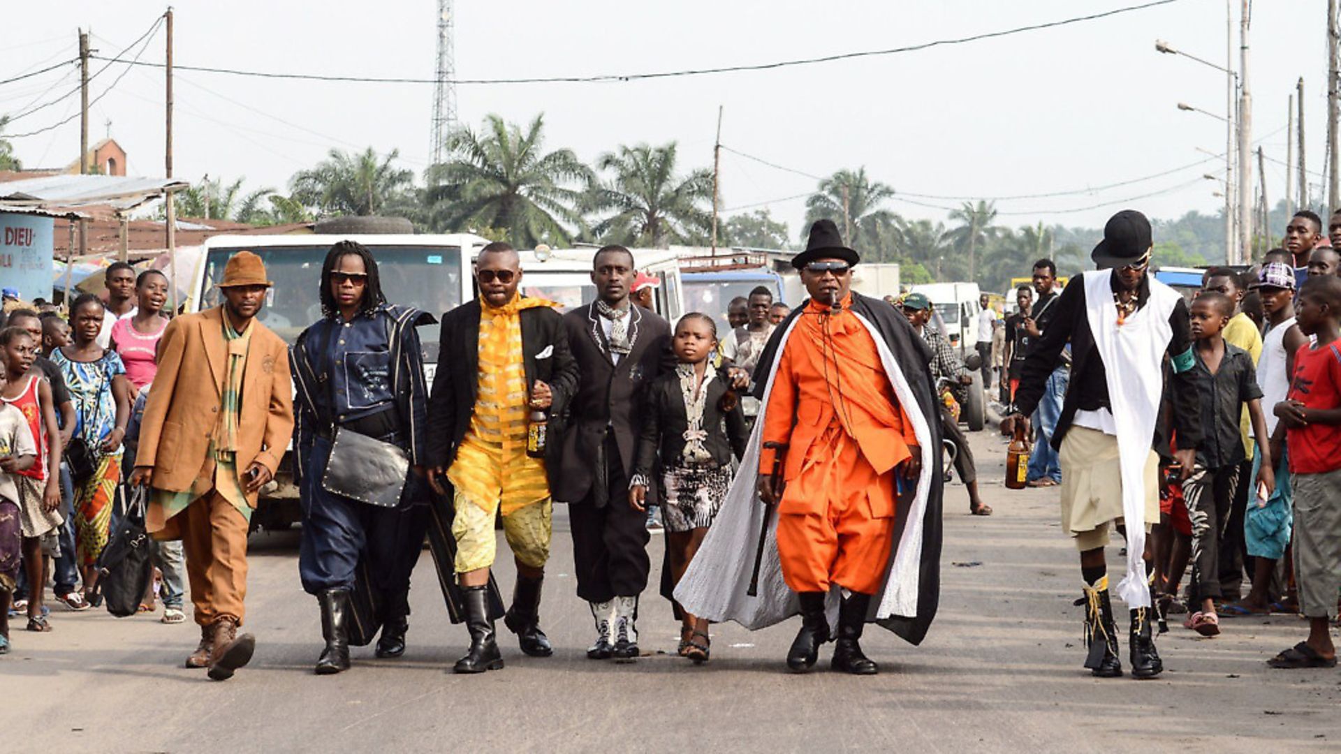 Adherents of La Sape (an abbreviation of The Society for the Advancement of Elegant People pose in Kinshasa) . Photo: Junior D. Kannah/AFP via Getty Images - Credit: AFP via Getty Images