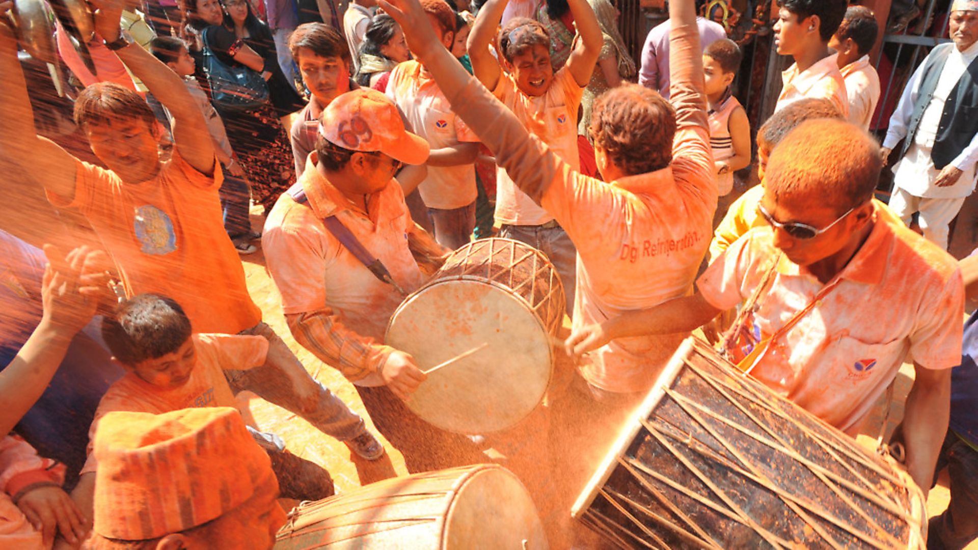 Nepalese revellers sing and dance to traditional music during The Bisket Jatra Festival at Thimi on the outskirts of Kathmandu on April 14, 2012. The traditional Bisket Jatra festival is celebrated during the Nepali New Year. AFP PHOTO/ Prakash MATHEMA (Photo credit should read PRAKASH MATHEMA/AFP via Getty Images) - Credit: AFP via Getty Images