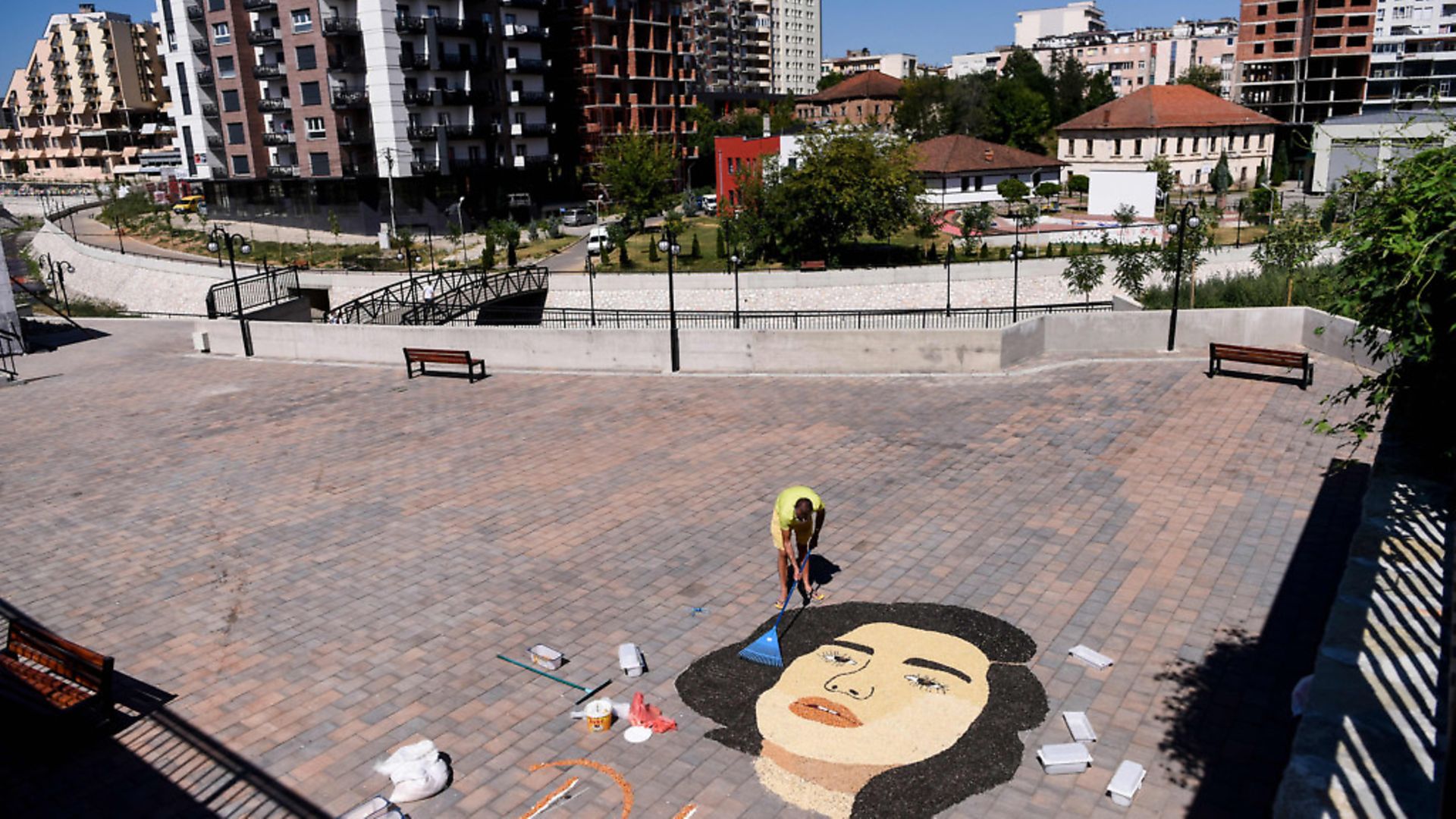 Kosovo artist Alkent Pozhegu works on the final touches of a mosaic made with grains and seeds, depicting the portrait of British pop star of Kosovo descent Dua Lipa, in Gjakova on July 29, 2020. (Photo by Armend NIMANI / AFP) (Photo by ARMEND NIMANI/AFP via Getty Images) - Credit: AFP via Getty Images