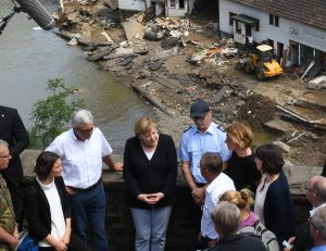 Angela Merkel speaks to locals on a bridge in Schuld, in Rhineland-
Palatinate.