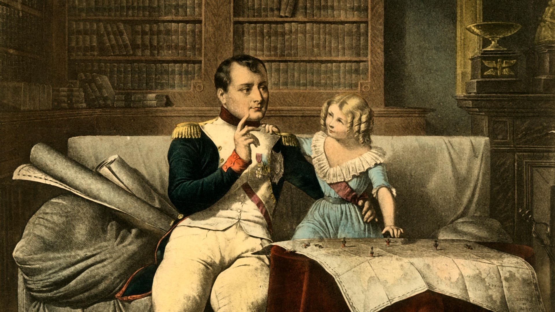 Napoleon, surrounded by books in his office, takes a break from reading to discuss military matter with a small child, in this image from 1921. Despite the dress and ringlets, this may be his son, also named Napoleon - Credit: The Print Collector/Heritage Ima