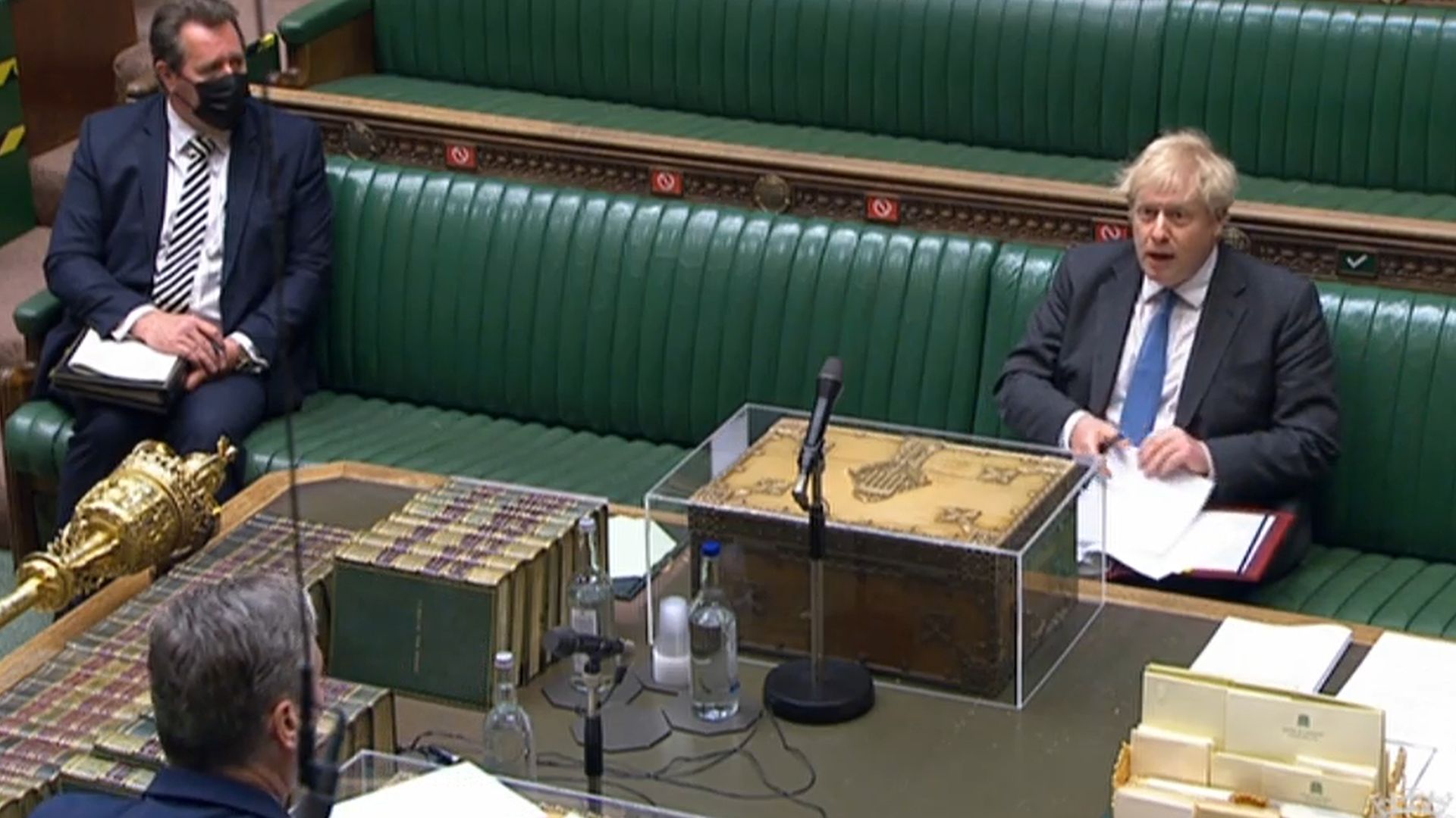 Prime minister Boris Johnson listens to Labour leader Keir Starmer during Prime Minister's Questions in the House of Commons, London - Credit: PA