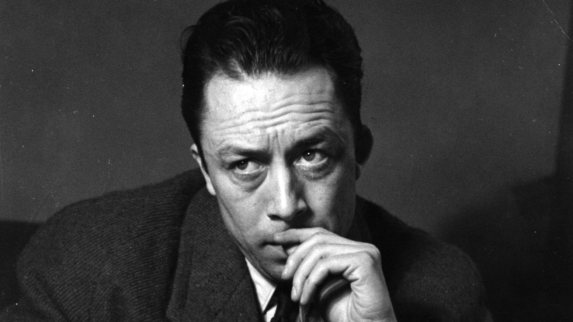 Albert Camus, on a visit to London in 1952 - Credit: Getty Images