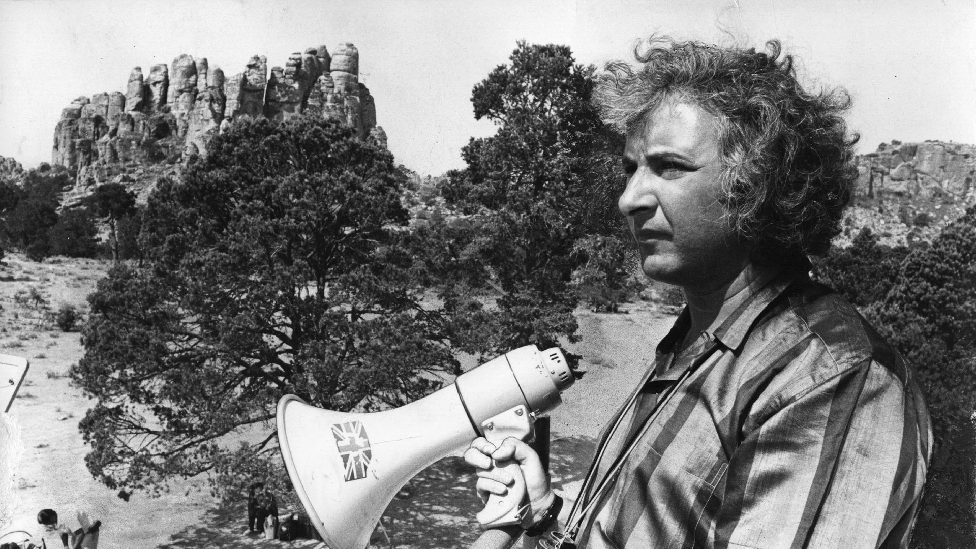 Michael Winner, on location in Cambridge, directing The Nightcomers. The 1971 film starred Marlon Brando - Credit: Getty Images