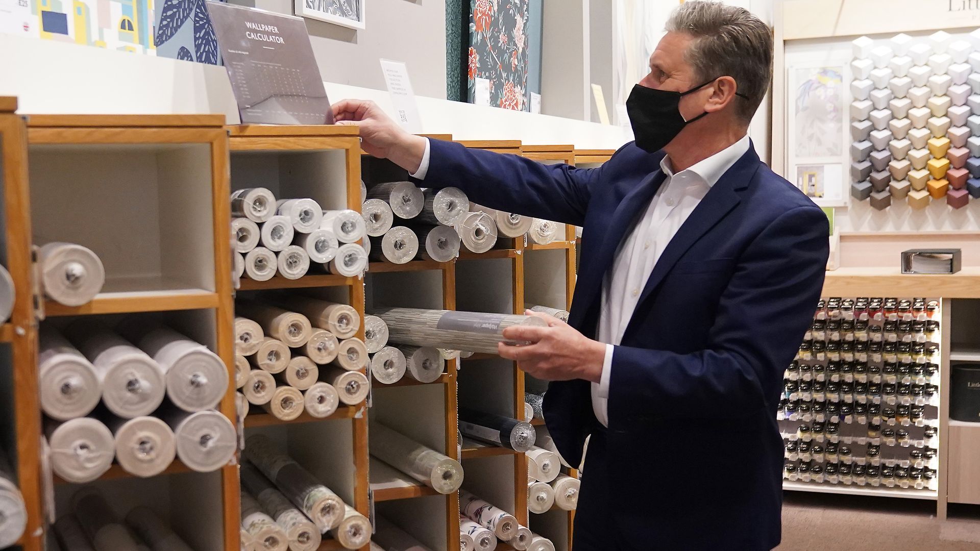 Labour Party leader Sir Keir Starmer browses through the wallpaper section at John Lewis - Credit: PA